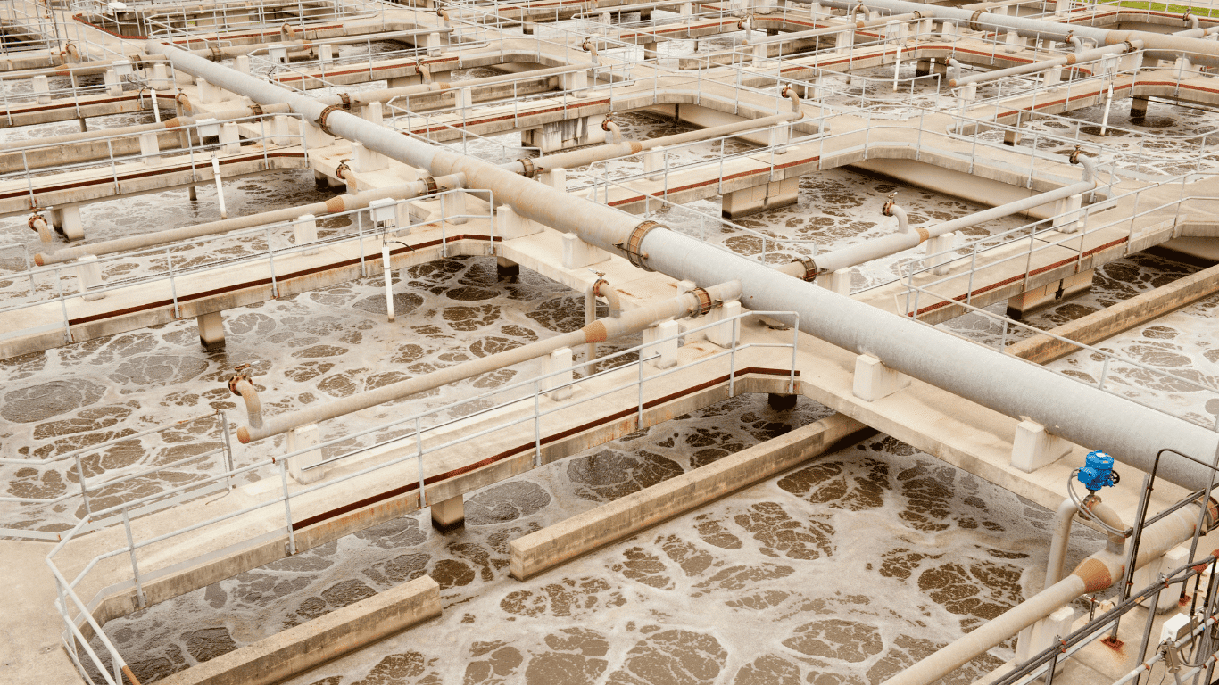 Modern industrial facility showcasing industrial wastewater treatment equipment used to treat wastewater in various industries, featuring large filtration tanks, monitoring systems, and piping that support wastewater treatment and advanced treatment technologies. The process involves membrane filtration, ion exchange, and sand filter stages that remove suspended solids, reduce total dissolved solids, and help break down organic matter in industrial wastewater. This comprehensive water treatment process reduces energy consumption, manages wastewater by-products, and protects the environment by improving the quality of wastewater before discharge.